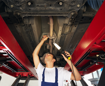 Man Working on a Cars Exhaust in Manassas, VA